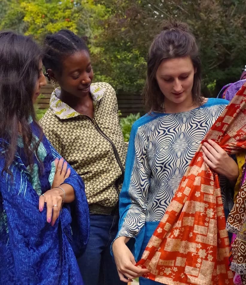 Friends gathered around Genki's recycled and handmade fabrics