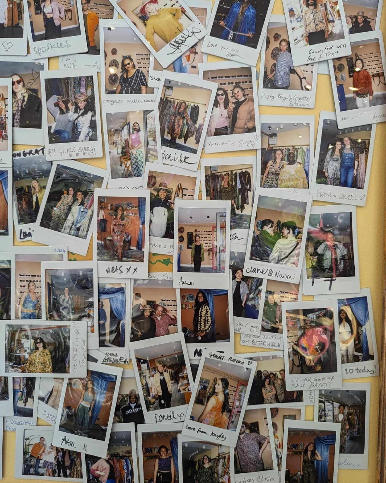 A wall of Polaroids from Maili and Genki's customers and friends